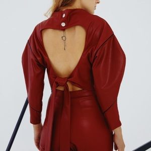 Open back top in red leather.